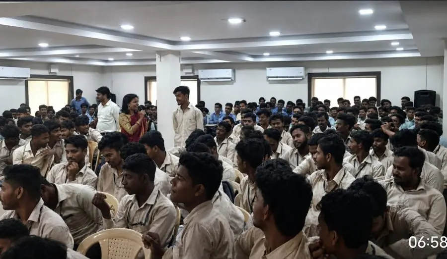 A large-scale career guidance seminar with students in a school auditorium